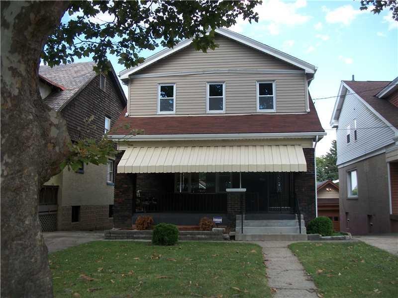 Exterior Front. Level front yard, covered front po