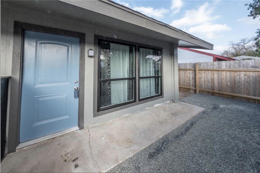 Doorway to property featuring fence