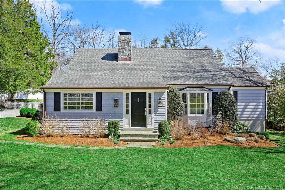 Pristine Nantucket style home. Beautifully landsca