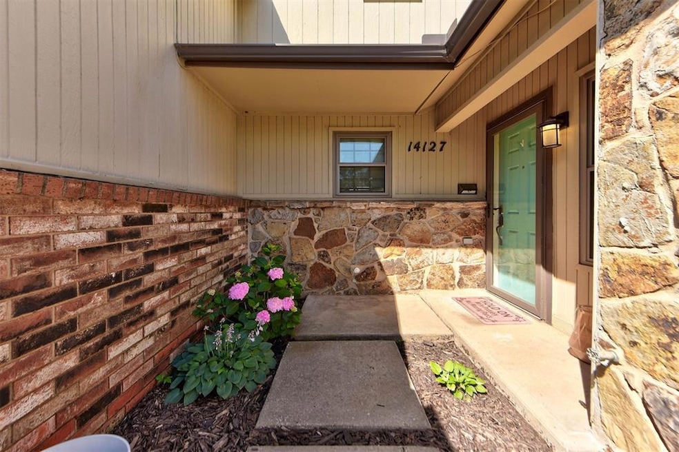 Property entrance featuring stone siding
