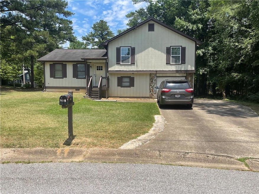 Tri-level home with a front yard