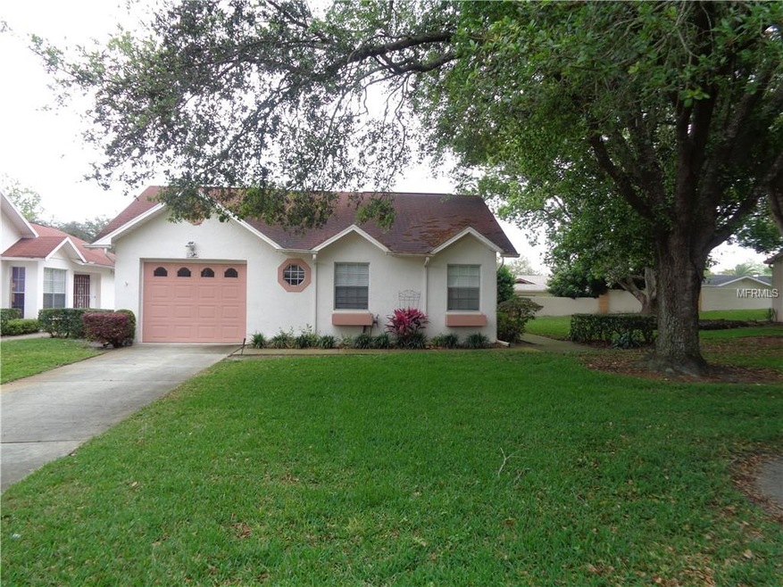 Stand alone villa with attached garage.