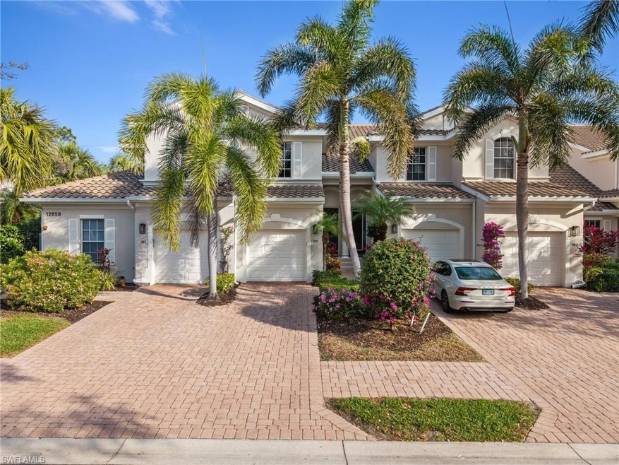 Mediterranean / spanish-style home with a garage