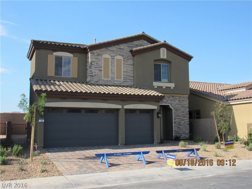 Stacked stone facade with paver driveway