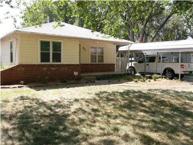 Front view of home with R.V. carport