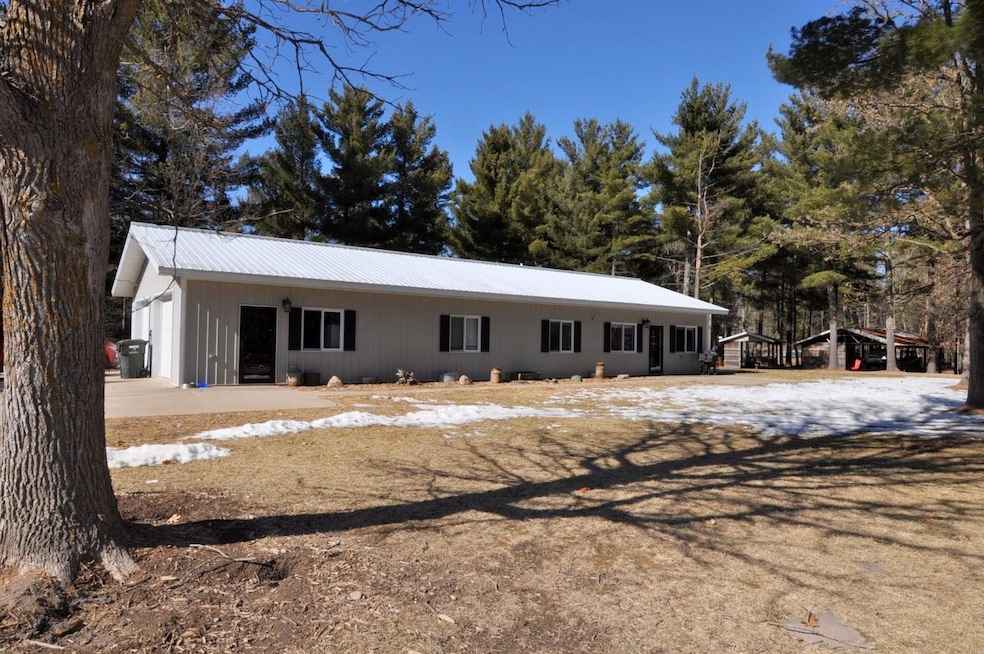 One-level living on 39.5 with 3 beds, 2 baths, attached garage and multiple outbuildings.  In-floor heat throughout home and garage is fueled by a propane boiler.