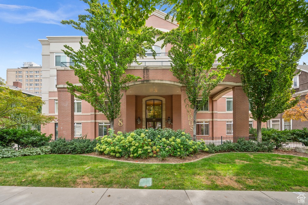 View of front facade featuring brick siding and a front yard