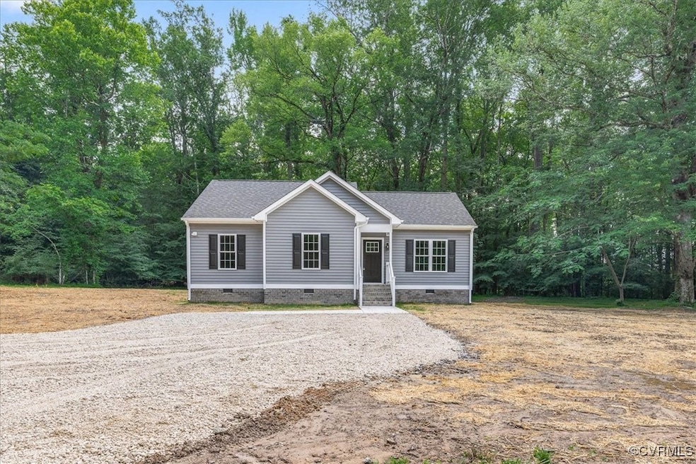 View of front of house featuring crawl space, a sh