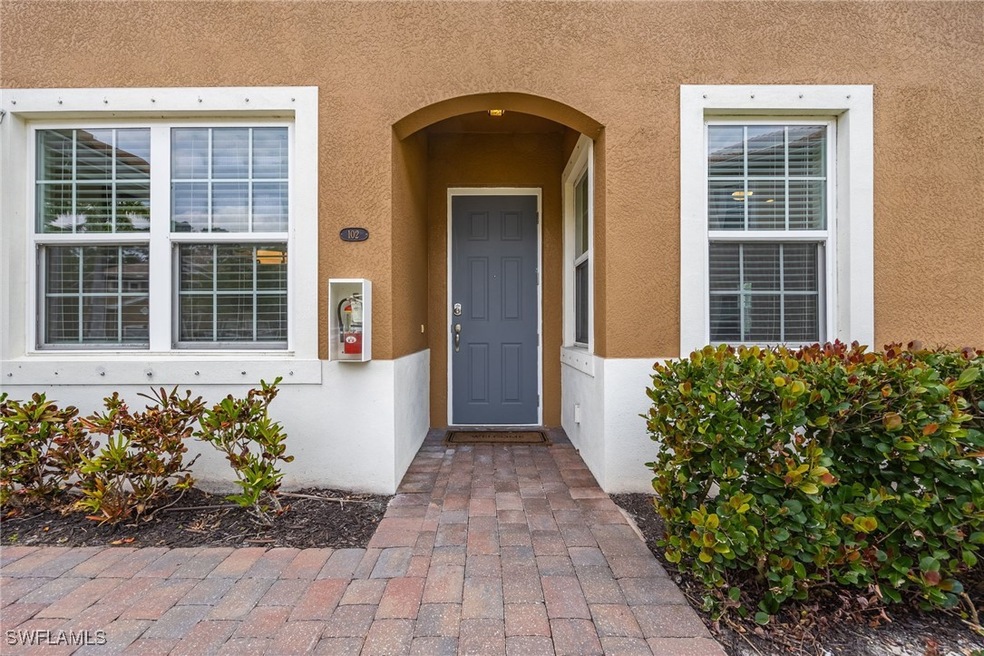 Property entrance with stucco siding