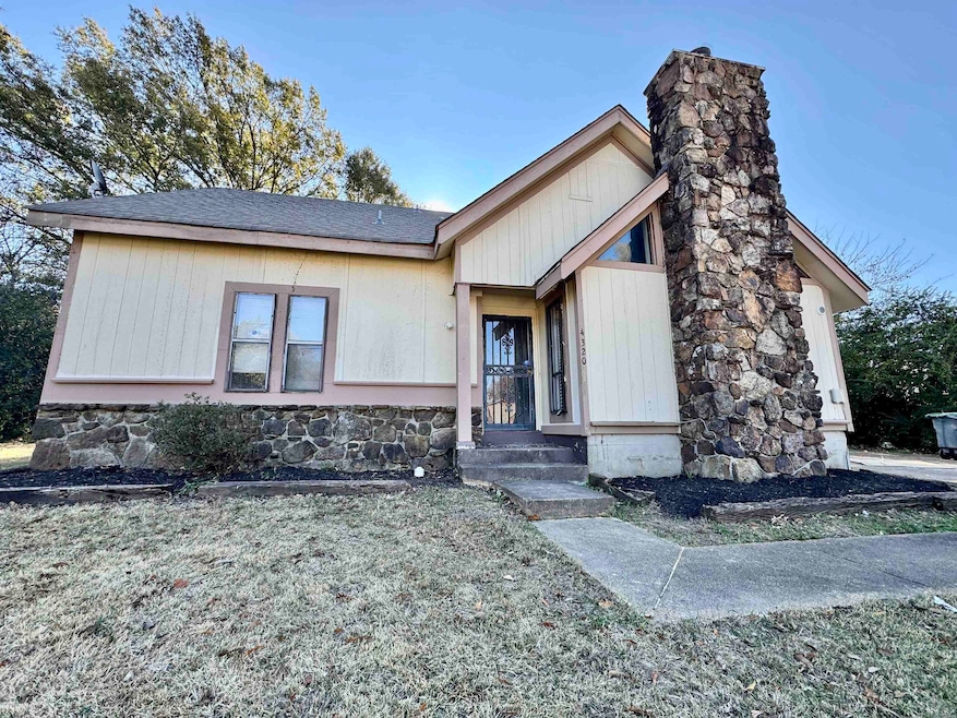 View of front of property with a front lawn