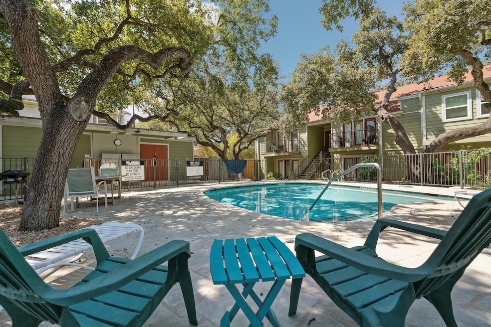 Community pool featuring a patio and stairway