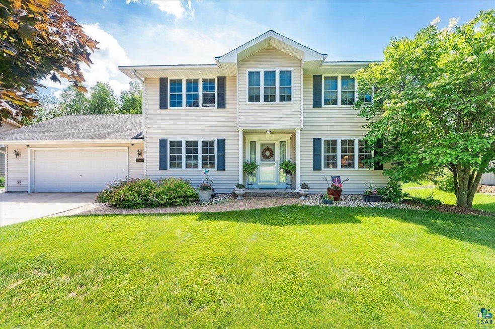 View of front of house with a garage and a front l