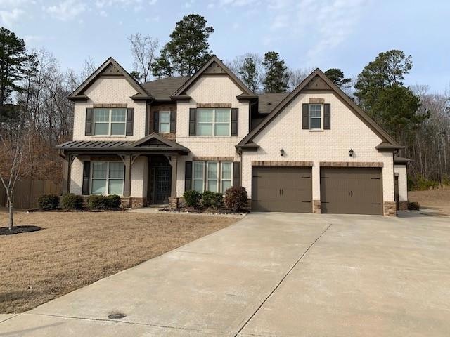 View of front of property with a garage