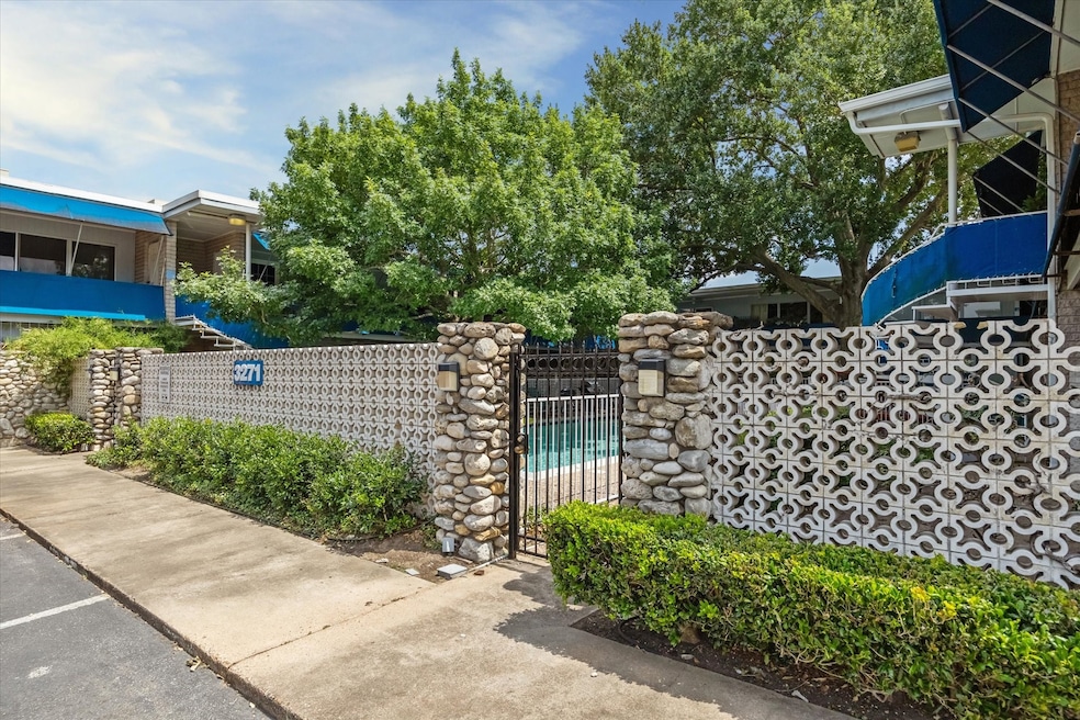 The entrance to Lamar Townhomes is marked by a dis