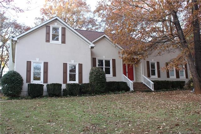 Front Elevation with large mature trees ad landsca