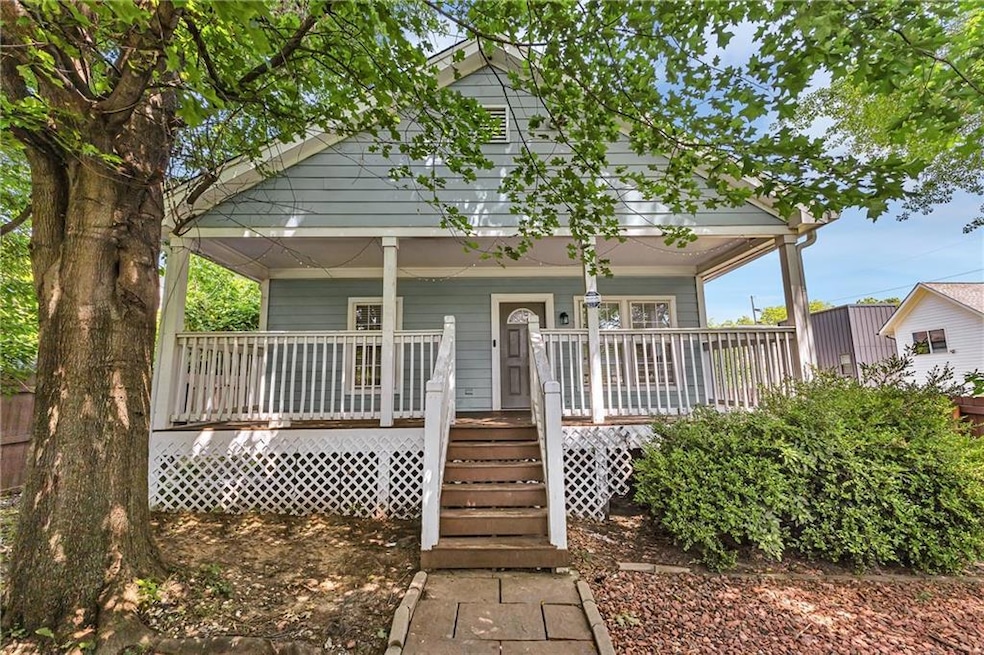 Shotgun-style home with covered porch