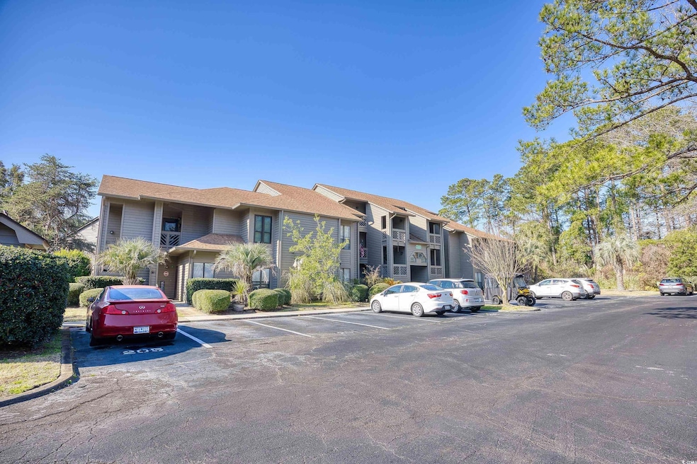 View of property with uncovered parking