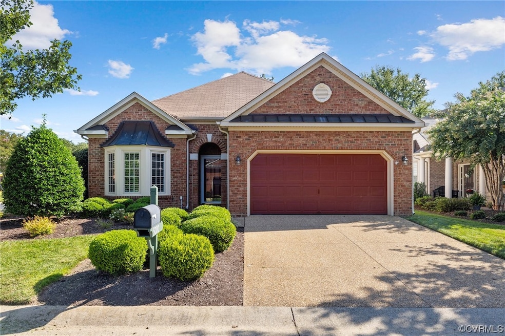 View of front facade featuring garage, corner lot