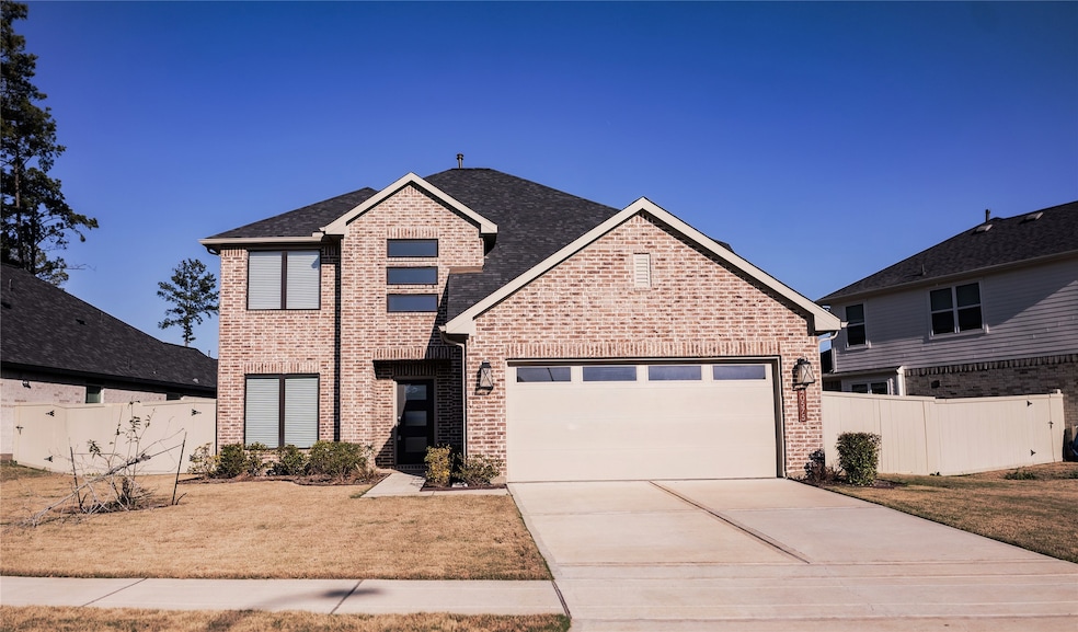 This is a two-story brick home with a modern desig