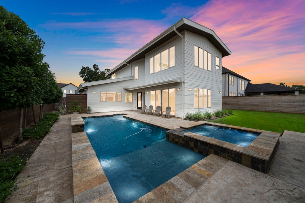 The pool and hot tub are steps from the door into