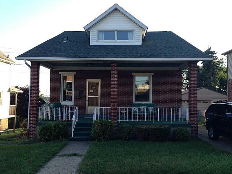 Exterior Front. Charming brick Cape Cod on quiet s