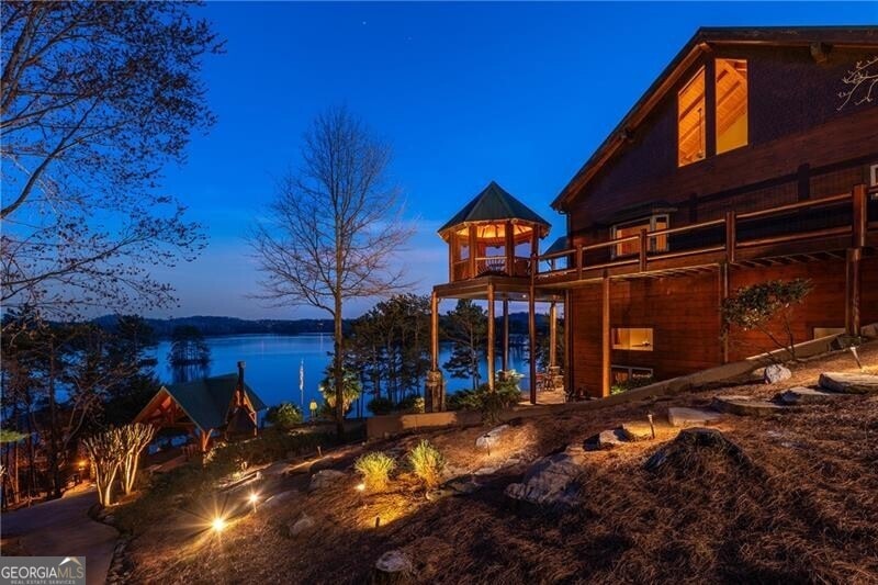 Poured concrete foundation by Blue Ridge Foundations. Paved golf cart path down to private dock.
