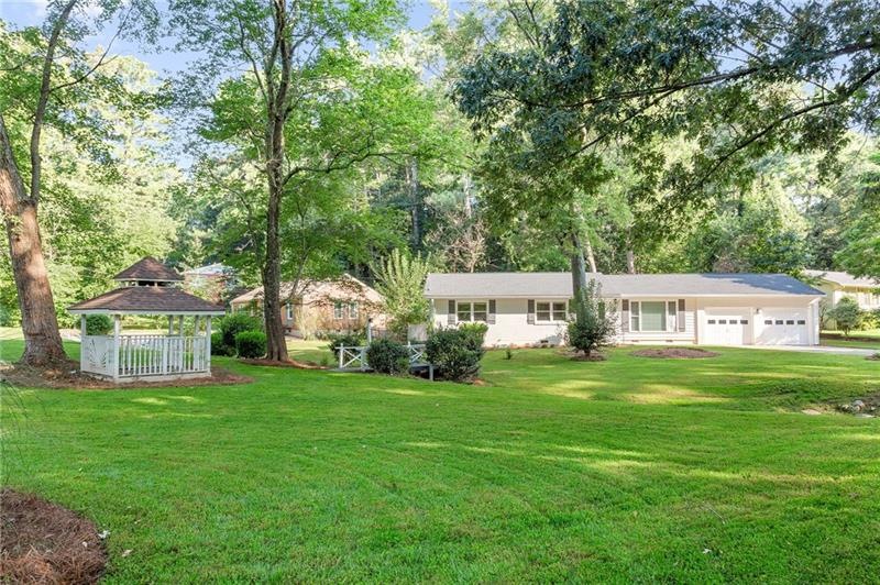 Completely remodeled home on large lot with stream
