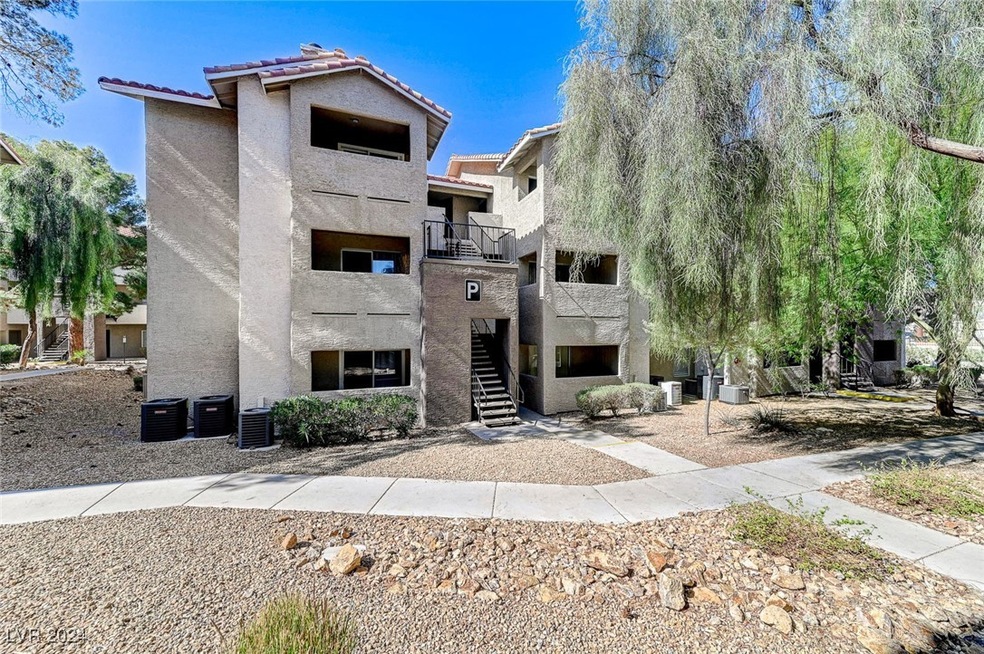 View of property with stairs and cooling unit