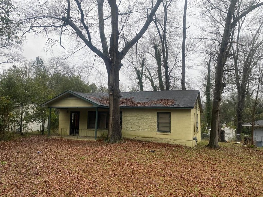 Rear view of property with a porch