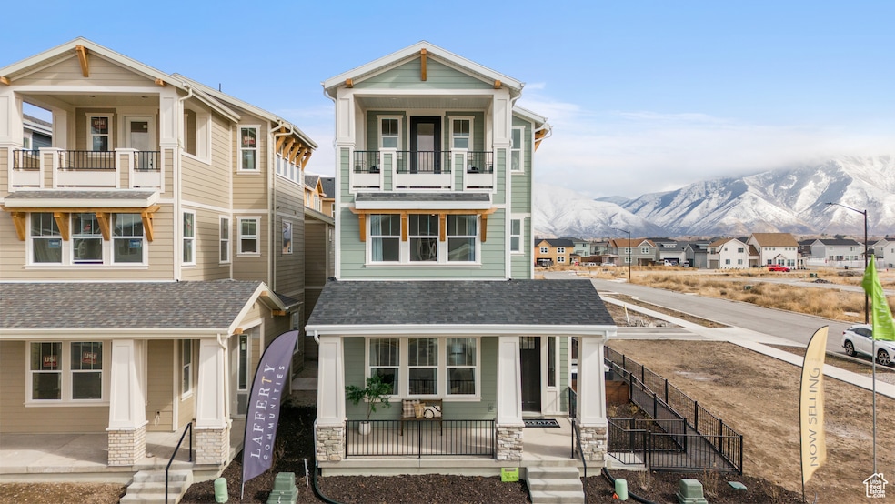 View of front of house with a residential view, a porch, roof with shingles, and a mountain view