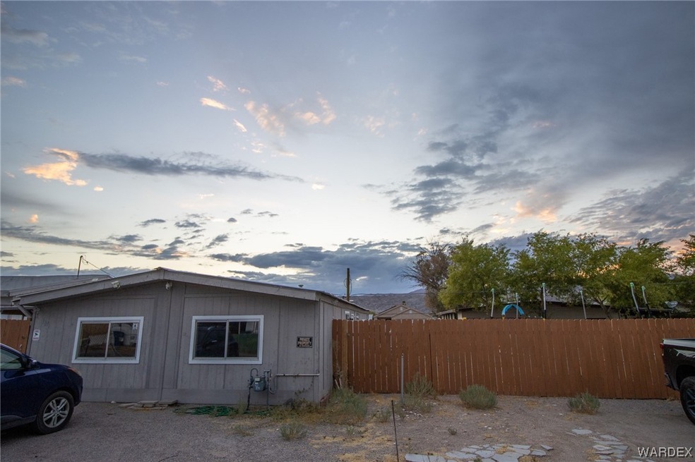 View of property exterior at dusk