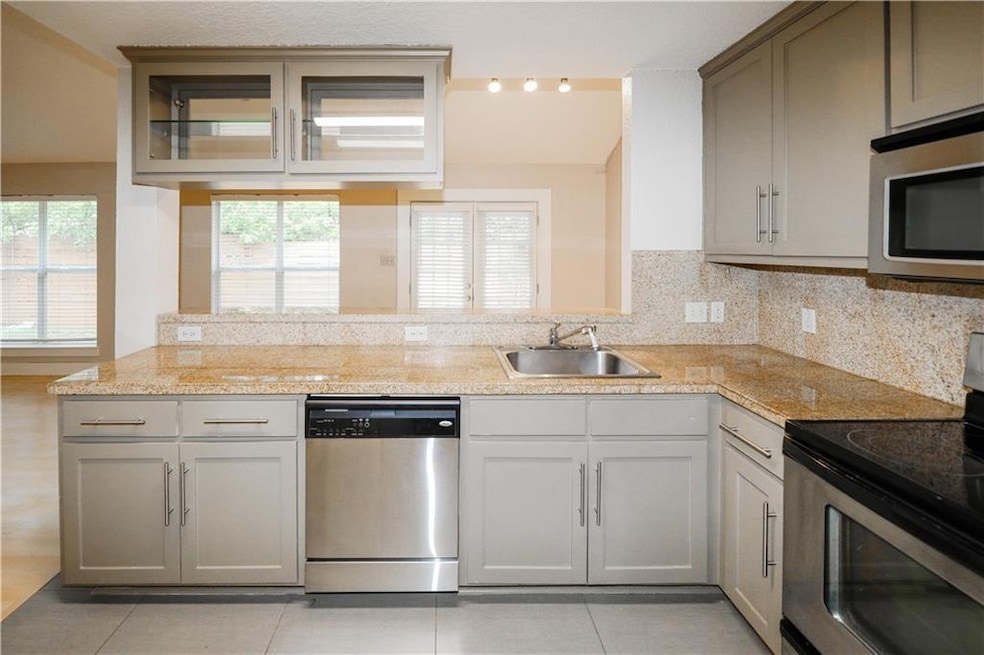Kitchen featuring stainless steel appliances, a p