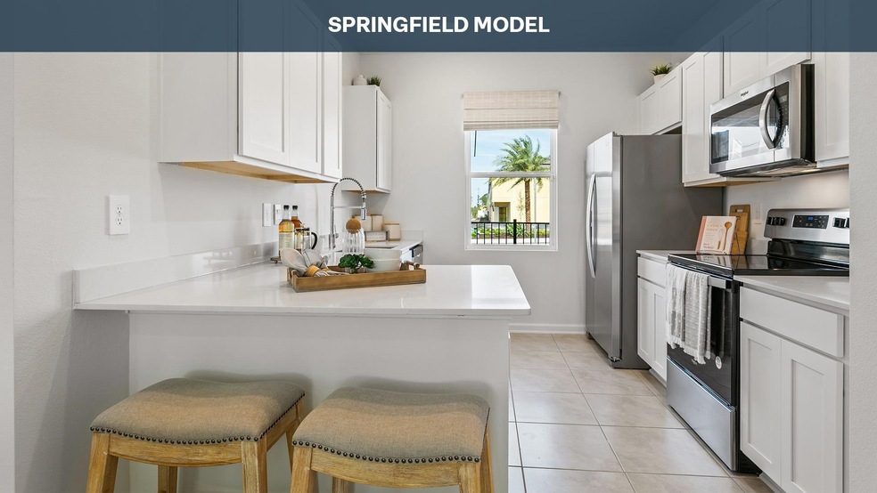 Kitchen with white cabinets, a kitchen breakfast b