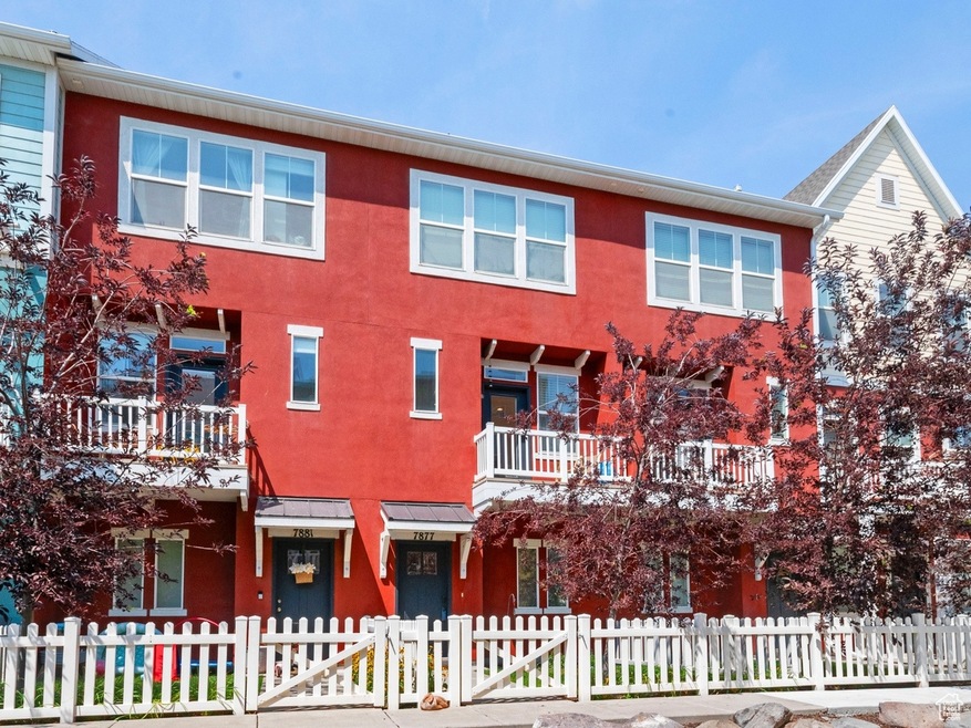 Back of property with a fenced front yard