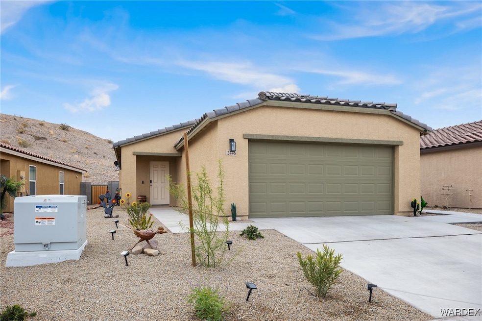 View of front of property featuring a tiled roof,