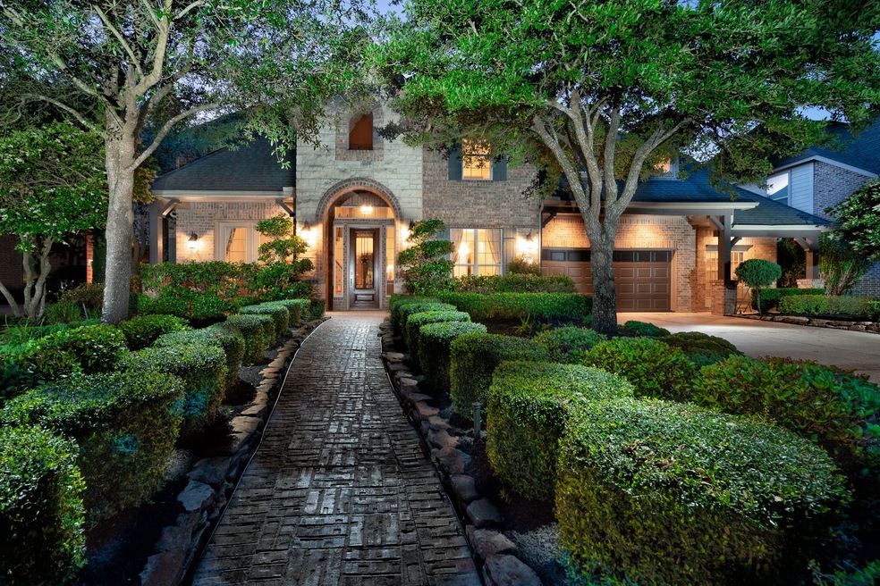 Gorgeous 2-story former Coventry model home in the community of Coles Crossing!  Follow the custom brick pathway up to the stately brick and stone elevation that adds such charm to the outside of the property!