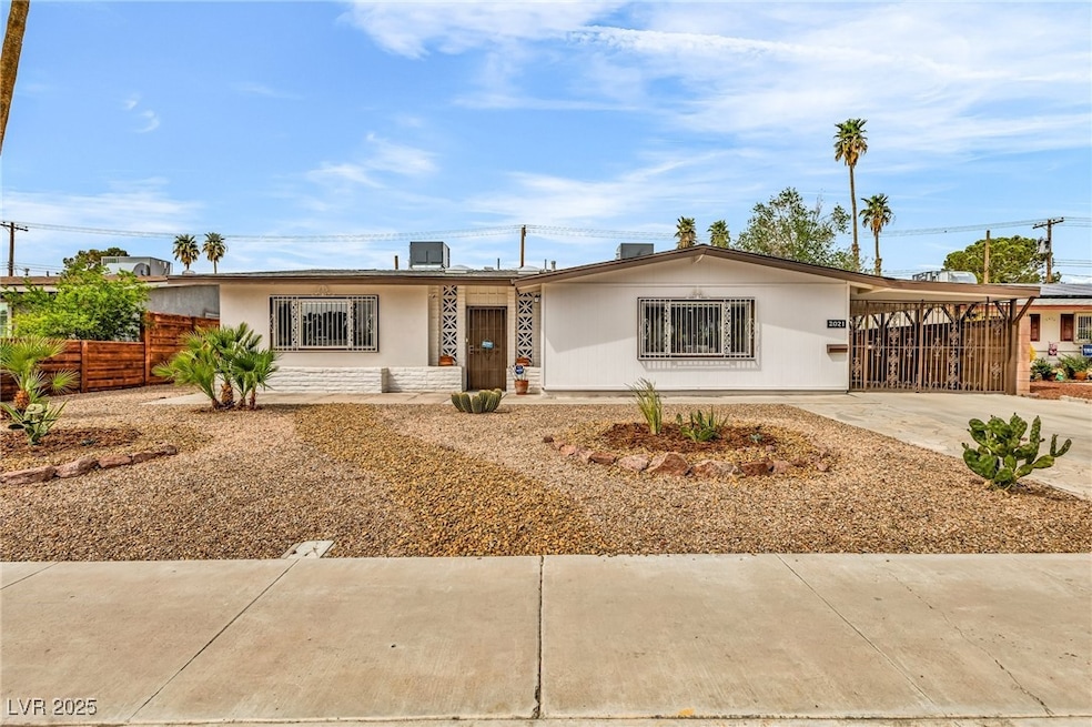 Single story home featuring an attached carport, c