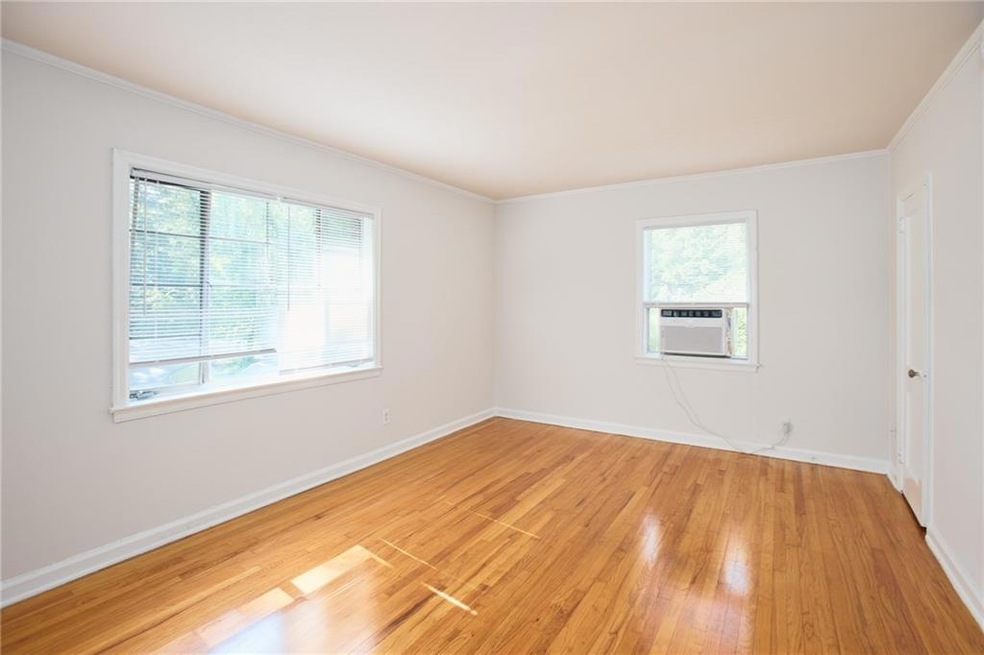 Empty room with light wood-style floors, plenty of