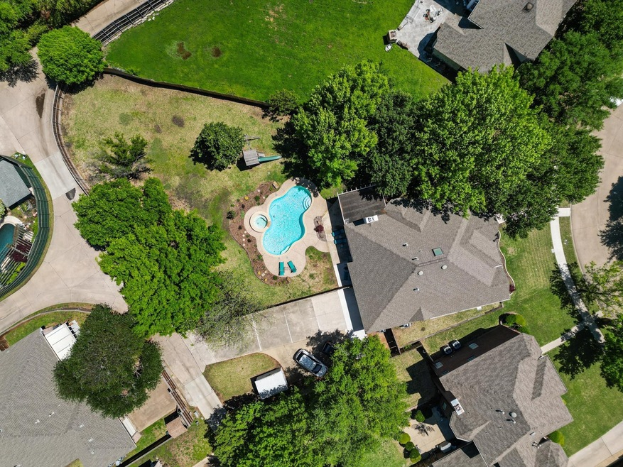 Aerial view of home on 1/2 acre lot with pool
