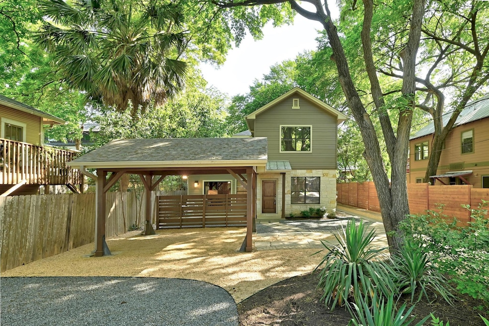 Back of property with stone siding and roof with 