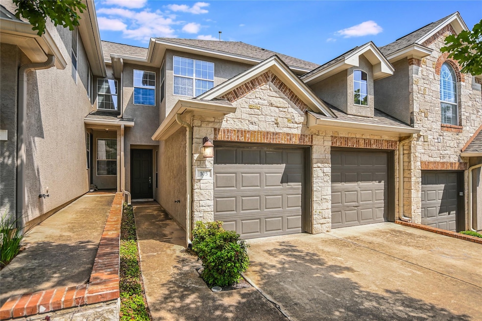 View of property featuring stone siding, stucco s