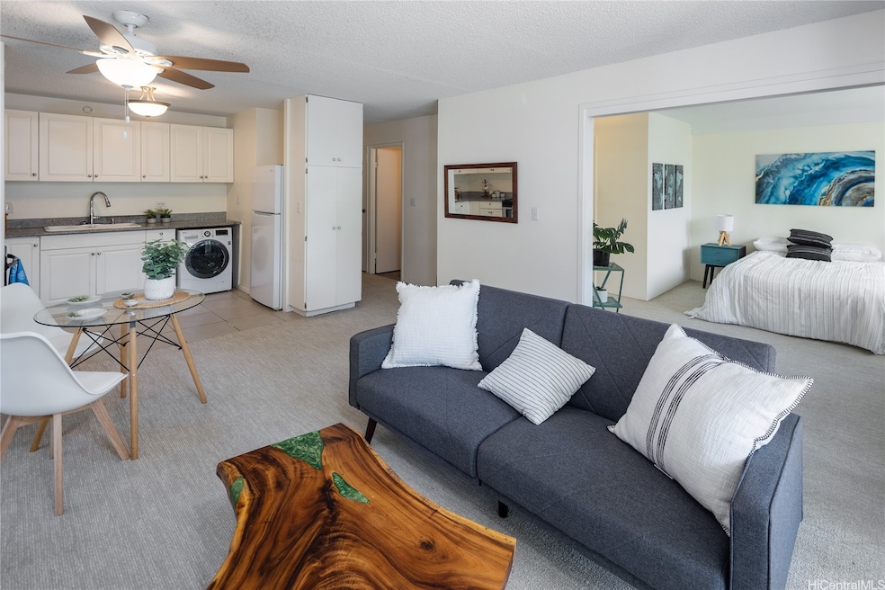 Living room, dining room and kitchen to the left and primary bedroom to the right.