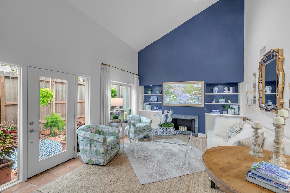 Warm terracotta tile flooring and a high, slanted