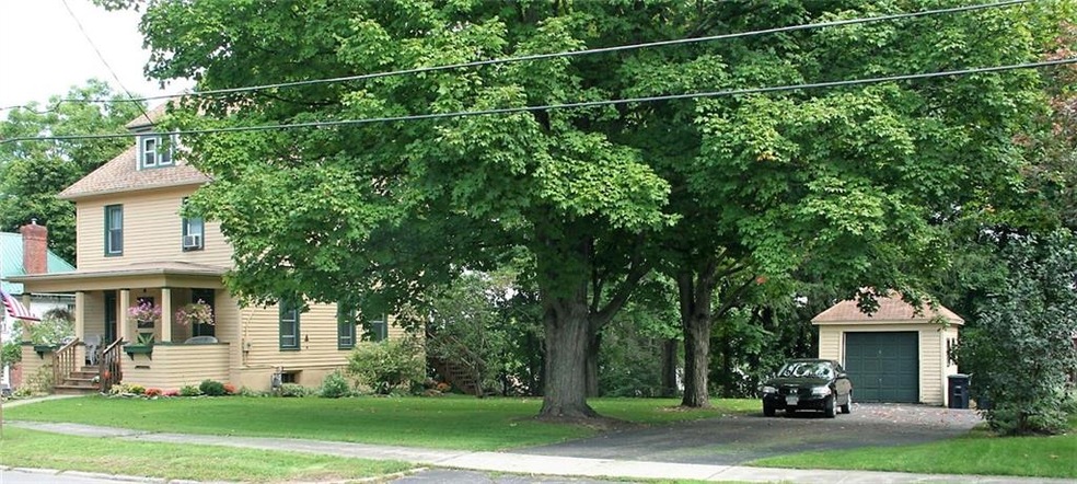 The large 1/3 acre yard,  1 car garage with plenty