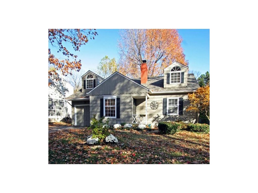 Darling Cape Cod with crisp white trim and welcomi