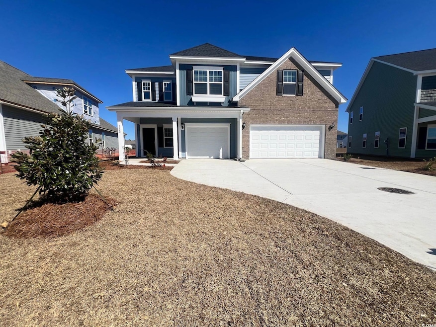View of front of property with brick siding, drive