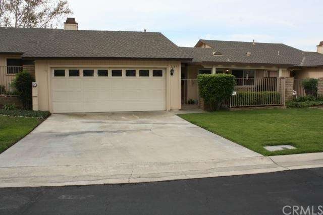 Front view showing attached two car garage with in