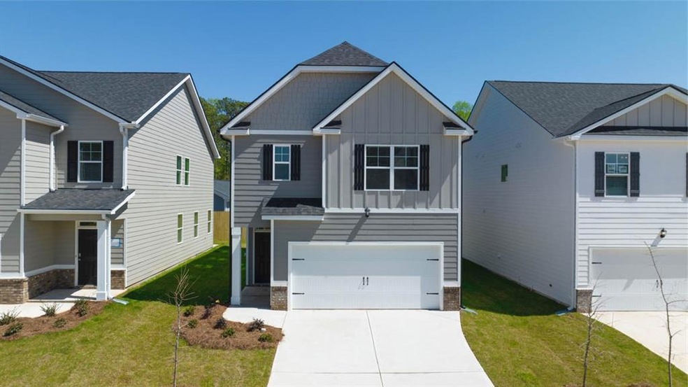 View of front of home featuring a garage and a fro