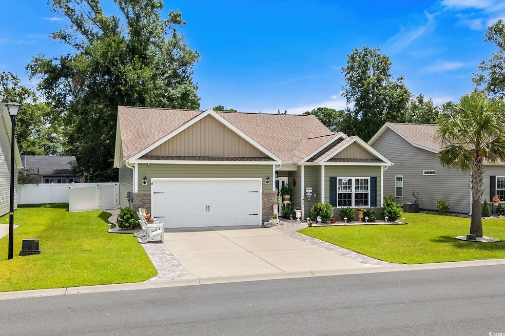 View of home's exterior featuring brick siding, driveway, and an attached garage