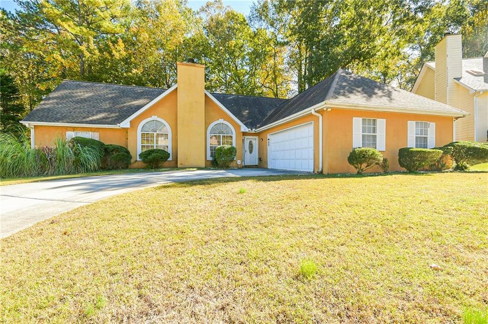 View of front of property with a front yard and a 
